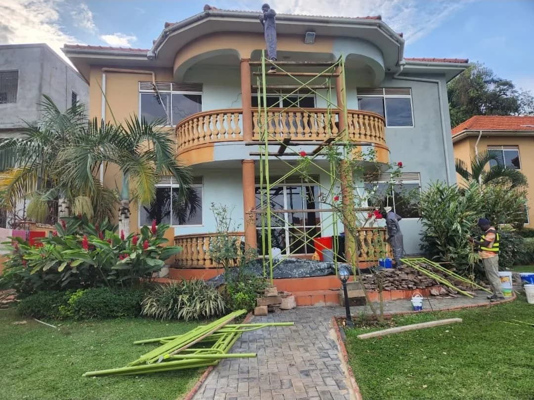 Contract painting crew working on a residential exterior